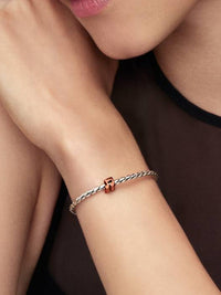 Music note sterling silver mini charm with orange enamel