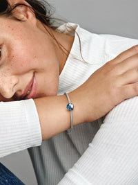 Globe sterling silver clip with transparent blue enamel