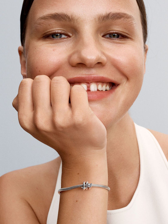 Twisting Arrow Charm