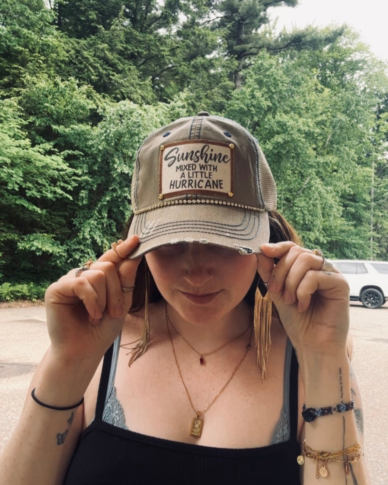 "Sunshine Mixed With a Little Hurricane" Distressed Trucker Cap