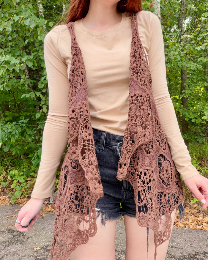 brown crochet vest over a beige top